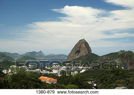 Aerial view of a cityscape with a mountain in the background, Sugarloaf Mountain, Guanabara Bay, Rio de Janeiro, Brazil View Large Photo Image Stock Photo - Aerial view of a cityscape with a mountain in the background, Sugarloaf Mountain, Guanabara Bay, Rio de Janeiro, Brazil. Fotosearch