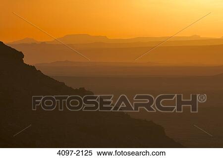 Stock Photography - Arid landscape at dusk, Monument Valley, Arizona-Utah, USA. Fotosearch