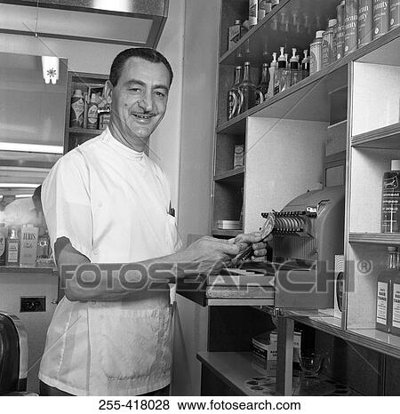 Barber in barber shop View Large Photo Image Stock Photo - Barber in barber shop. Fotosearch