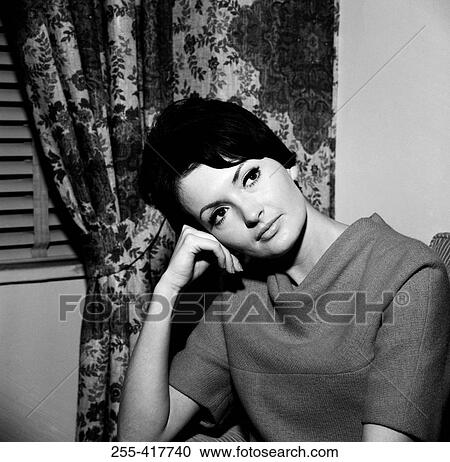 Beautiful young woman daydreaming View Large Photo Image Stock Image - Beautiful young woman daydreaming. Fotosearch