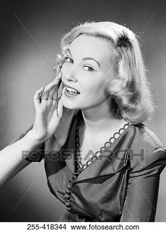 Blonde woman whispering View Large Photo Image Picture - Blonde woman whispering. Fotosearch