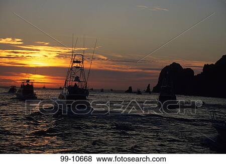 Boats in the sea at sunset, Bisbee's Black And Blue Marlin Tournament, Cabo San Lucas, Baja California, Mexico View Large Photo Image Stock Photo - Boats in the sea at sunset, Bisbee's Black And Blue Marlin Tournament, Cabo San Lucas, Baja California, Mexico. Fotosearch
