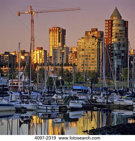 Stock Photo - Boats moored at a harbor, Coal Harbor, Vancouver, British Columbia, Canada. Fotosearch