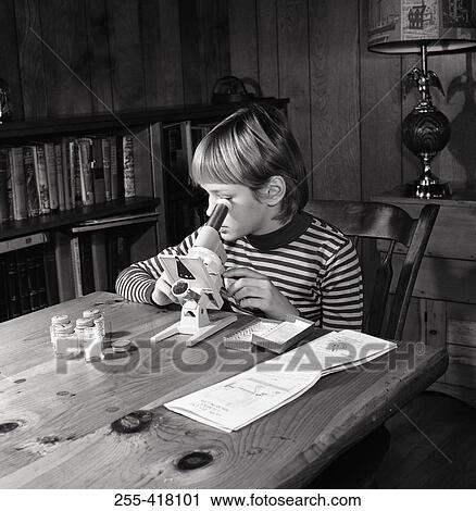 Stock Image - Boy doing homework. Fotosearch