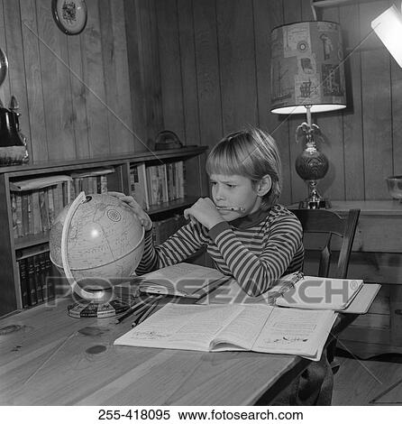 Stock Photography - Boy doing homework. Fotosearch