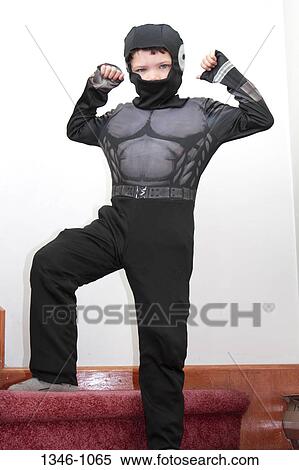 Boy dressed up like a superhero View Large Photo Image Stock Photography - Boy dressed up like a superhero. Fotosearch
