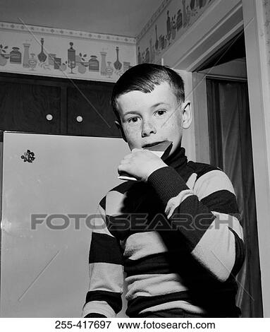 Boy eating bar of chocolate View Large Photo Image Stock Photo - Boy eating bar of chocolate. Fotosearch