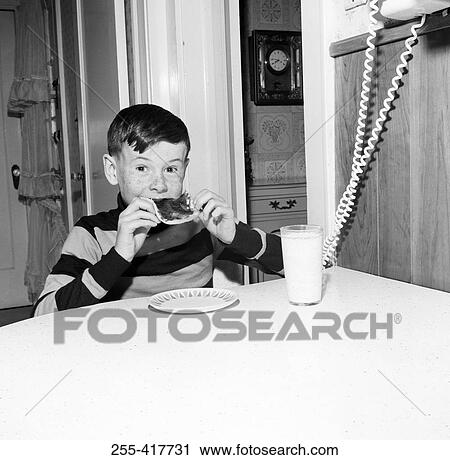 Boy eating bread with jam View Large Photo Image Stock Image - Boy eating bread with jam. Fotosearch
