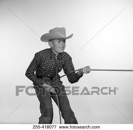 Boy in cowboy costume View Large Photo Image Stock Photo - Boy in cowboy costume. Fotosearch