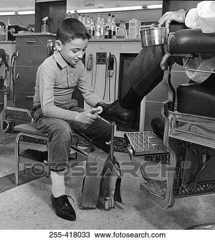 Boy polishing men's shoe View Large Photo Image Stock Image - Boy polishing men's shoe. Fotosearch
