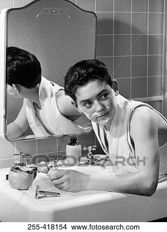 Picture - Boy shaving. Fotosearch