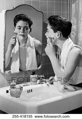 Stock Photography - Boy shaving. Fotosearch