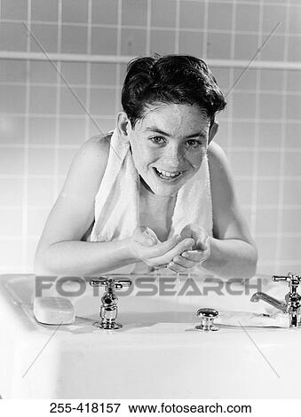 Stock Photo - Boy washing face. Fotosearch