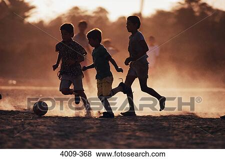 Boys playing soccer on the beach, Cabo San Lucas, Mexico View Large Photo Image Stock Photo - Boys playing soccer on the beach, Cabo San Lucas, Mexico. Fotosearch
