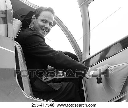 Stock Photo - Businessman boarding private plane. Fotosearch