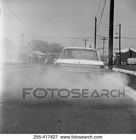Car smoking on the road View Large Photo Image Stock Photo - Car smoking on the road. Fotosearch