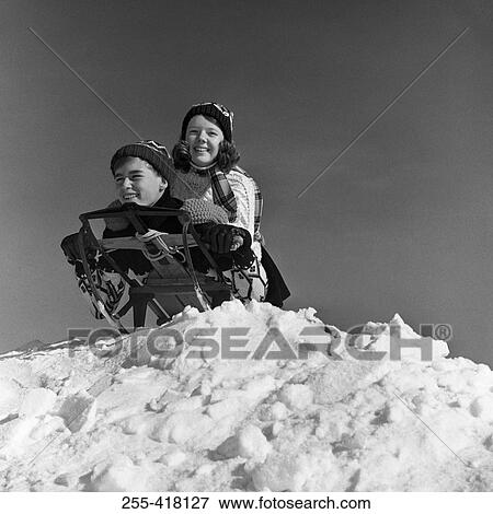 Stock Photo - Children on sledge. Fotosearch
