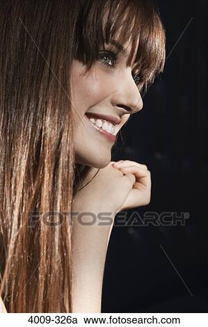 Stock Image - Close-up of a woman smiling. Fotosearch