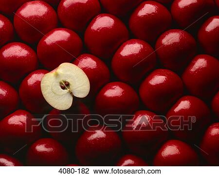 Close-up of red apples with one cut in half View Large Photo Image Stock Image - Close-up of red apples with one cut in half. Fotosearch