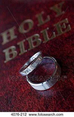 Close-up of wedding rings on Bible View Large Photo Image Stock Image - Close-up of wedding rings on Bible. Fotosearch