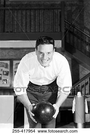 Picture - Close-up view of man bowling. Fotosearch