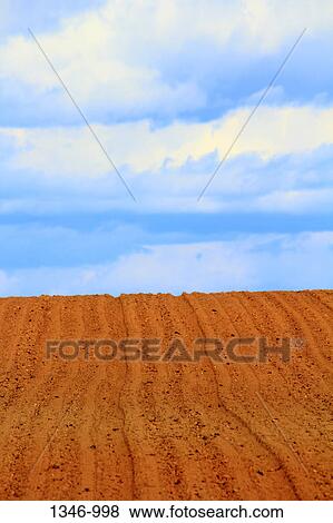 Clouds over plowed field View Large Photo Image Stock Photo - Clouds over plowed field. Fotosearch