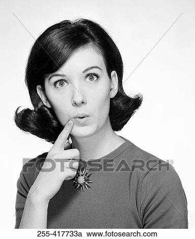 Stock Image - Confused young woman portrait. Fotosearch