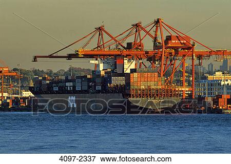 Stock Photo - Container ship at a cargo terminal, Burrard Inlet, Vancouver, British Columbia, Canada. Fotosearch