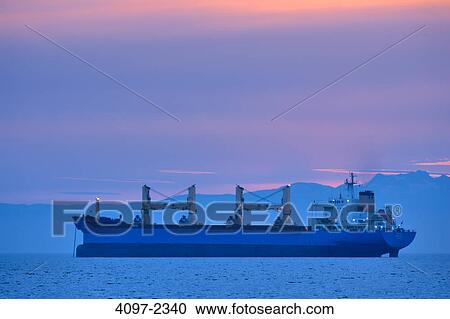 Container ship in the sea at sunset, English Bay, Vancouver, British Columbia, Canada View Large Photo Image Stock Image - Container ship in the sea at sunset, English Bay, Vancouver, British Columbia, Canada. Fotosearch