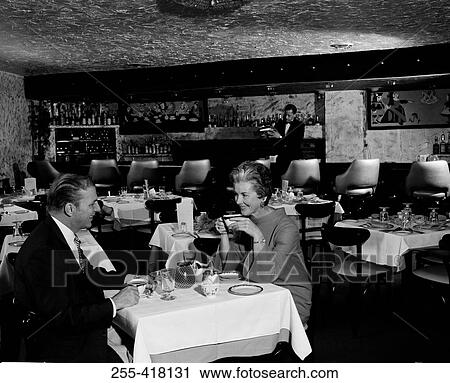 Couple dining in restaurant View Large Photo Image Stock Image - Couple dining in restaurant. Fotosearch