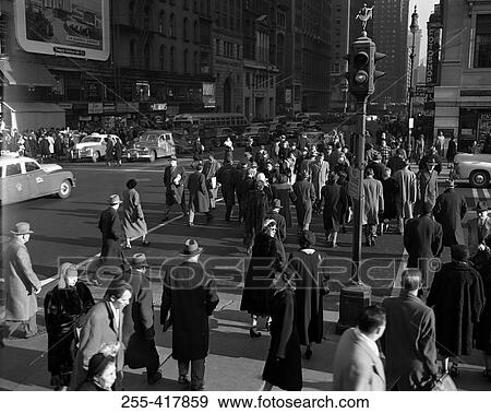 Stock Photo - Crowd of people walking on street. Fotosearch