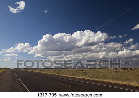 Developing storm clouds over a highway, New Mexico, USA View Large Photo Image Stock Photography - Developing storm clouds over a highway, New Mexico, USA. Fotosearch