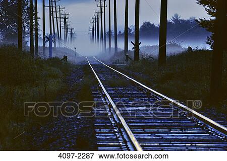 Electricity pylons along a railroad track, Fraser Valley, British Columbia, Canada View Large Photo Image Stock Photo - Electricity pylons along a railroad track, Fraser Valley, British Columbia, Canada. Fotosearch
