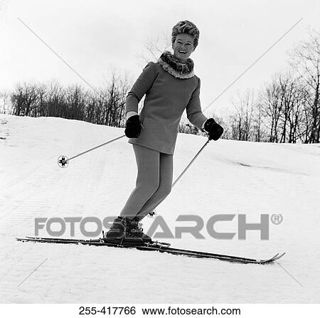 Elegant woman smiling and skiing View Large Photo Image Stock Photograph - Elegant woman smiling and skiing. Fotosearch