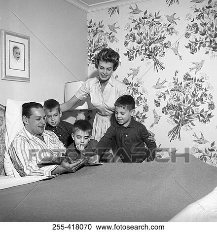 Family around ill father's bed View Large Photo Image Stock Image - Family around ill father's bed. Fotosearch