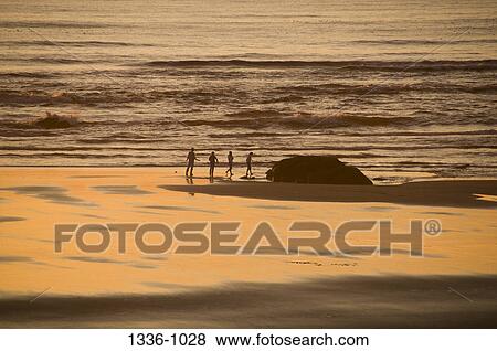 Stock Photo - Family on the beach, Oregon, USA. Fotosearch