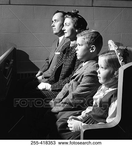 Stock Image - Family sitting in church. Fotosearch