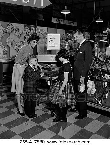 Family with two children in department store View Large Photo Image Stock Image - Family with two children in department store. Fotosearch