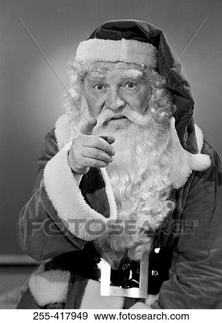 Father christmas pointing finger at camera View Large Photo Image Stock Photo - Father christmas pointing finger at camera. Fotosearch