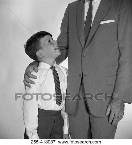 Father embracing son View Large Photo Image Stock Photo - Father embracing son. Fotosearch