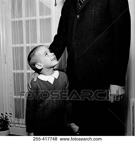 Father standing with son View Large Photo Image Stock Photo - Father standing with son. Fotosearch