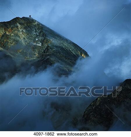 Stock Image - Fog over mountain, Jasper National Park, Alberta, Canada. Fotosearch