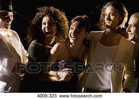Friends having fun in a party, Manhattan, New York City, New York State, USA View Large Photo Image Stock Image - Friends having fun in a party, Manhattan, New York City, New York State, USA. Fotosearch