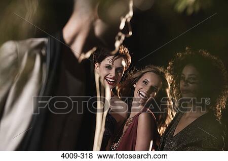 Friends having fun in a party, Manhattan, New York City, New York State, USA View Large Photo Image Stock Photo - Friends having fun in a party, Manhattan, New York City, New York State, USA. Fotosearch