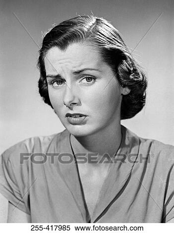 Stock Photography - Frowning young woman, portrait. Fotosearch