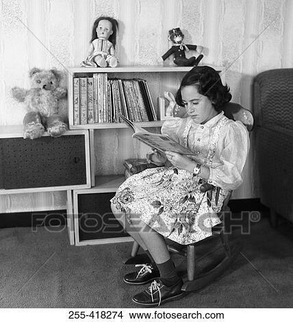 Girl reading book View Large Photo Image Picture - Girl reading book. Fotosearch