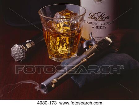 Glass of scotch with a duelling pistol View Large Photo Image Stock Image - Glass of scotch with a duelling pistol. Fotosearch