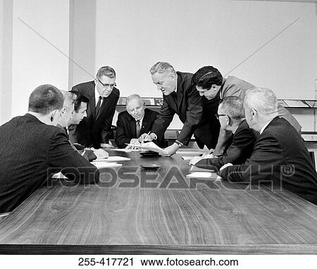 Group of businessmen at meeting View Large Photo Image Stock Image - Group of businessmen at meeting. Fotosearch