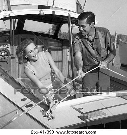 Stock Image - Happy couple on yacht. Fotosearch