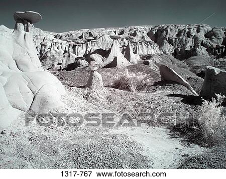 Hoodoo rock formations in a desert, Ah-Shi-Sle-Pah Badlands, New Mexico, USA View Large Photo Image Stock Photo - Hoodoo rock formations in a desert, Ah-Shi-Sle-Pah Badlands, New Mexico, USA. Fotosearch